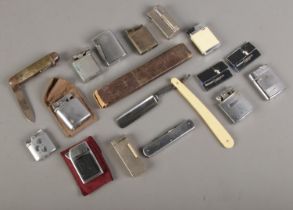 A quantity of lighters and knives. Includes Kendal Dent cut throat razor, Ronson, etc. CANNOT POST