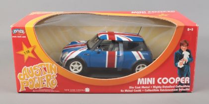 A boxed Joy Ride 1/18 scale diecast Mini Cooper from Austin Powers.