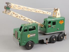 A Louis Marx & Co. tin plate crane/truck, with moveable extendable arm.