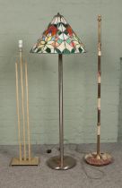 Three standard lamps and lamp bases. To include Tiffany style and onyx base examples. Some cracks
