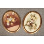 A pair of oval oil paintings, canvas laid on wooden panel, still life of flowers with gilt frame.