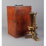 A cased R & J Beck cased brass microscope with selection of accessories and lenses. Not all