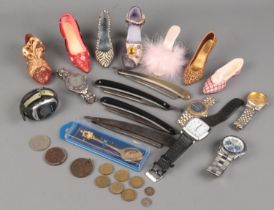 A small quantity of collectables. Includes cut throat razors, wristwatches, Just The Right Shoe,