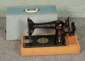 A Singer sewing machine in case, model number F6815203
