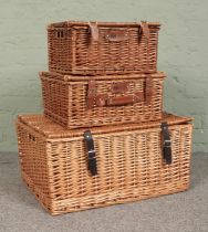 Three wicker picnic hamper baskets, to include two Regency Hampers examples. Largest - Height: 31cm,