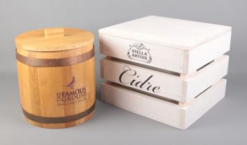 Two promotional ice buckets, one of The Famous Grouse example and the other Stella Artois Cidre