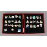 Thirty-three Gary Patterson Cat pin badges, in hinged collectors box.