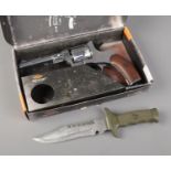 A boxed Gletcher NGT F silver .177cal air gun along with bottle of pellets and The Last Fighter
