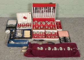 A large collection of flatware, to include canteen of cutlery, boxed Oneida spoons, silver