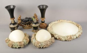 A collection of resin ornamental pieces including pair of urns, vases and centrepiece together