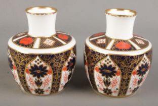 A pair of Royal Crown Derby Imari baluster shape vases. 1128 pattern, 11cm. First quality. Fair