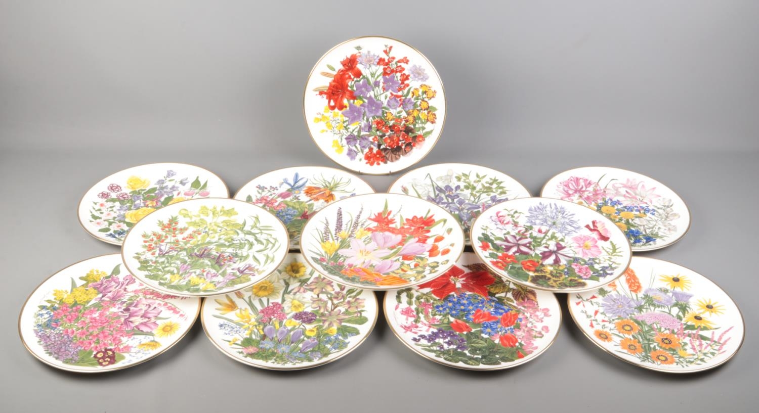 Franklin Porcelain; twelve RHS 'Flowers of the Year' cabinet plates, depicting flowers of the month,