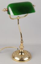 A vintage brass desk lamp with green glass shade. (49cm)