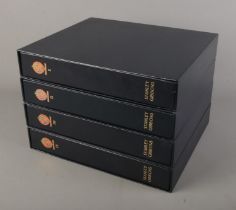 Four-volume set of the Stanley Gibbons albums in slip cases for Great Britain, first album partially