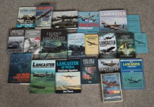 A large collection of military aviation books and reproduction pocket notes and manuals focusing