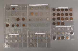 A collection of coins including silver florins, shillings as well as some Australian and New Zealand