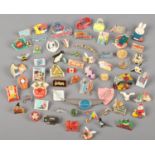A quantity of vintage pin badges.