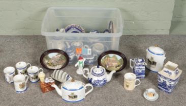 A quantity of Ringtons ceramics. Includes teapots, lidded jars, Snowman figure, wall plaques, etc.