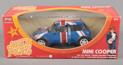 A boxed Joy Ride 1/18 scale diecast Mini Cooper from Austin Powers.