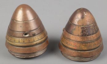 Two WWI artillery shell fuses. Both bearing broad arrow marks to the base.