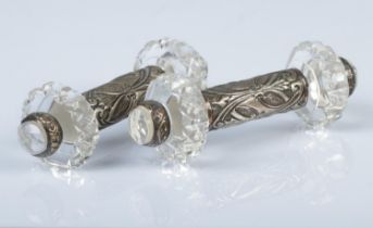 A pair of Victorian silver and crystal knife rest featuring scroll decoration. Hallmarked Birmingham