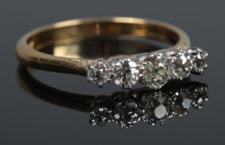 A large 18ct Gold five stone Diamond ring, the largest stone being approximately Â¼ct. Size S. Total