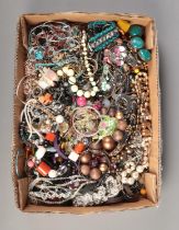 A tray of assorted costume jewellery, to include necklaces, bracelets and bangles.