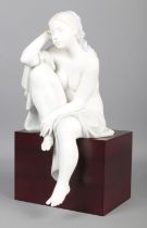 A Limited Edition Lladro figure; 'Lost in Thought', raised on wooden base. No. 215/1500. With