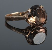 A 9ct Gold smoky quartz dress ring. Diameter of stone: 13mm. Size MÂ½. Total weight: 3.6g