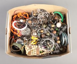 A box of various items of costume jewellery, to include large beaded necklaces, bangles, bracelets