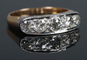 An 18ct Gold and Platinum five stone diamond ring. Size MÂ½. Total weight: 5.2g