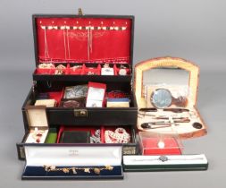 A black Mele cantilever jewellery box with contents of mostly costume jewellery. To include beaded