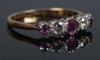 An 18ct Gold five stone Ruby and Diamond ring. Size K. Total weight: 2.1g.