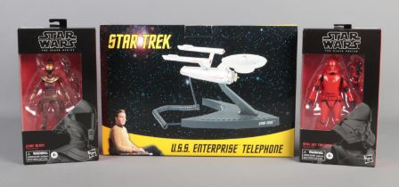A Star Trek U.S.S Enterprise telephone along with two Star Wars The Black Series figures.