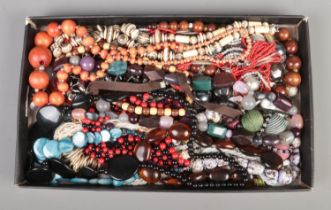 A tray containing a collection of beaded necklaces and necklets.