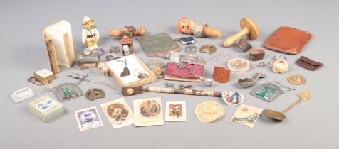 A tray of assorted collectables, to include novelty bottle stoppers, darning mushroom, miniature