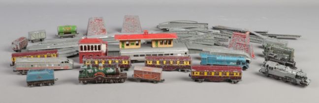 A box of Lone Star "Locos" miniature model railway to include track, stations, assorted carriages,
