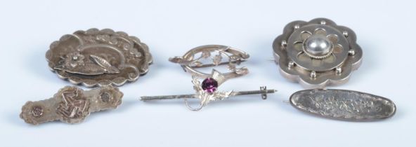 Six silver and white metal brooches, to include Victorian, Sweetheart and Isle of Man examples.