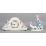 Two pieces of Lladro ceramics, 'Two Sisters' mantle clock and 'Hurry Now' geese and girl figure