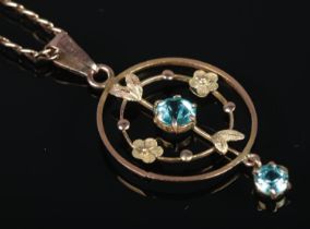 An Edwardian 9ct Gold pendant, set with pale blue stones, on 9ct Gold chain. Total weight: 3.1g