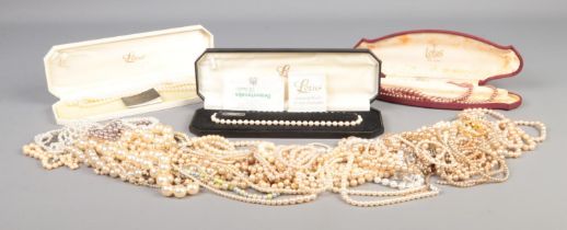 A quantity of simulated pearls, including boxed Lotus examples, one with silver clasp.