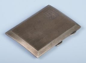 A silver hinged cigarette case, with monogram initials 'BVC' and engine decoration. Assayed for