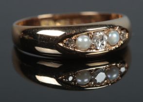 A Victorian 18ct Gold five stone Pearl and Diamond ring. Size M. Total weight: 3.3g W.M, M.P