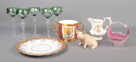 A collection of ceramics and glassware. Includes green flash glasses, Tuscan commemorative loving