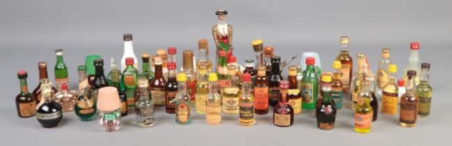 A large quantity of alcohol miniatures, to include Freezomint Creme De Menthe, Pernod, Malibu,