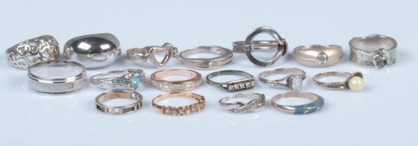 Seventeen silver rings, of varying sizes and designs. To include diamond set and pierced heart