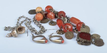 Three pieces of assorted jewellery, to include Indian gilt compass, coral hooped earrings and