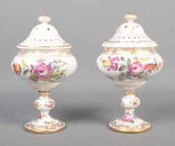 A pair of hand painted continental Meissen style pot pourri jar and cover. Decorated with flowers (