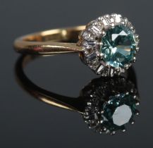 An 18ct Gold, Blue Zircon and Diamond cluster ring. Size K. Total weight: 3.5g.