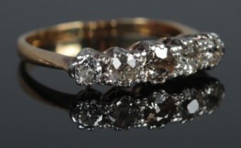 An 18ct Gold and Platinum five stone Diamond ring. Size K. Total weight: 2.6g.